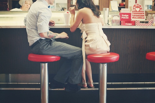 dating couple sitting at counter