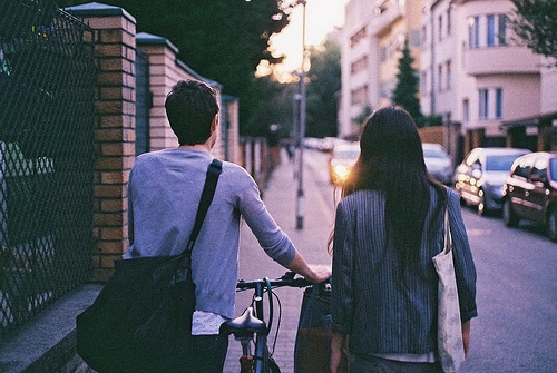 Man and Woman walking down a road