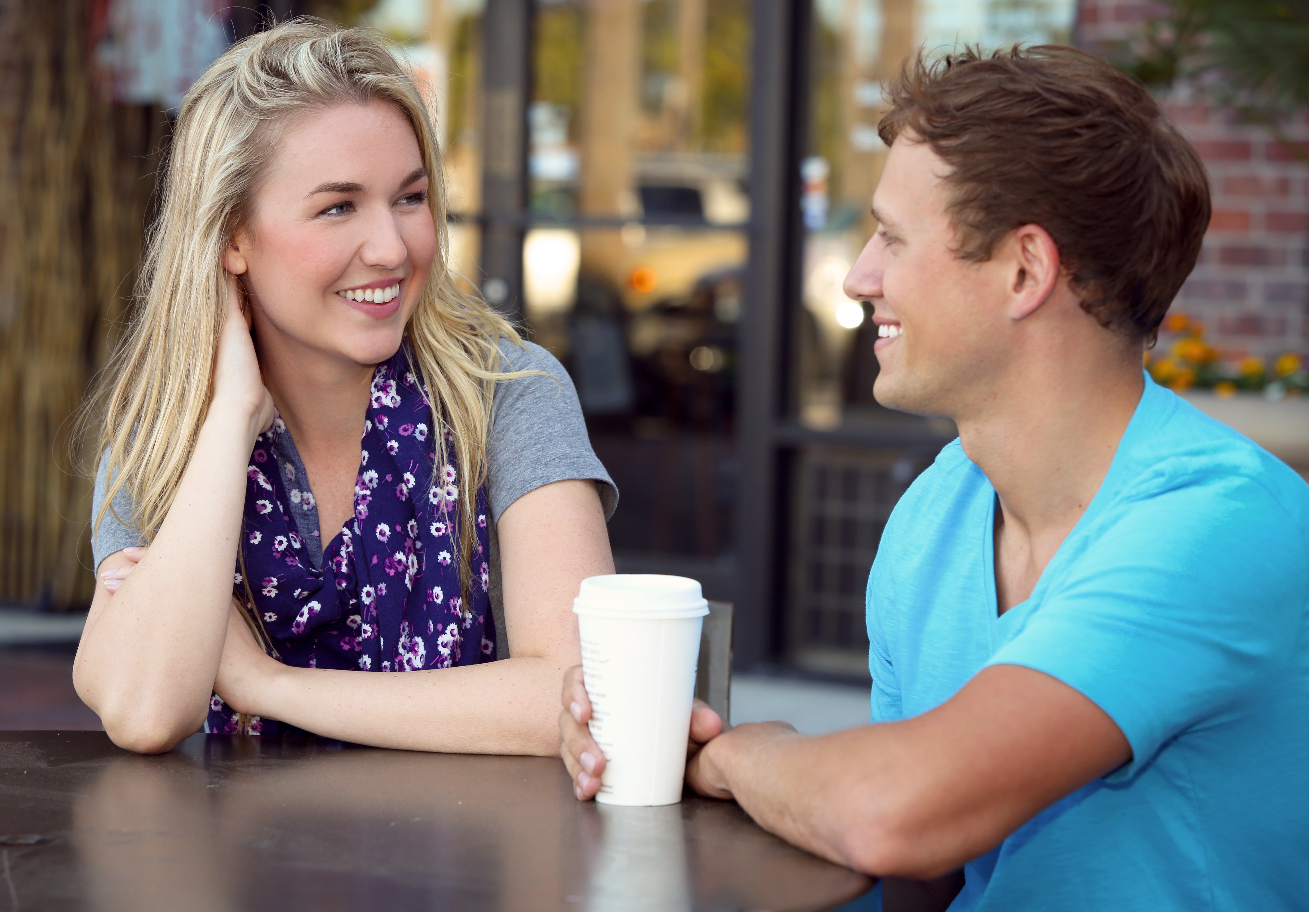 young man and women sharing a coffee date