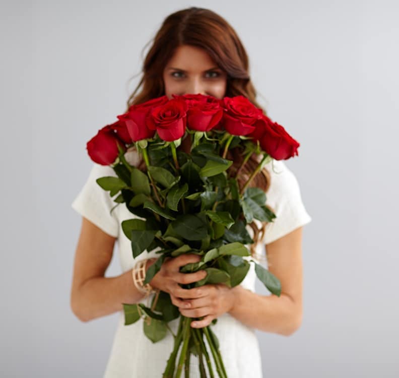 woman holding bunch of Roses