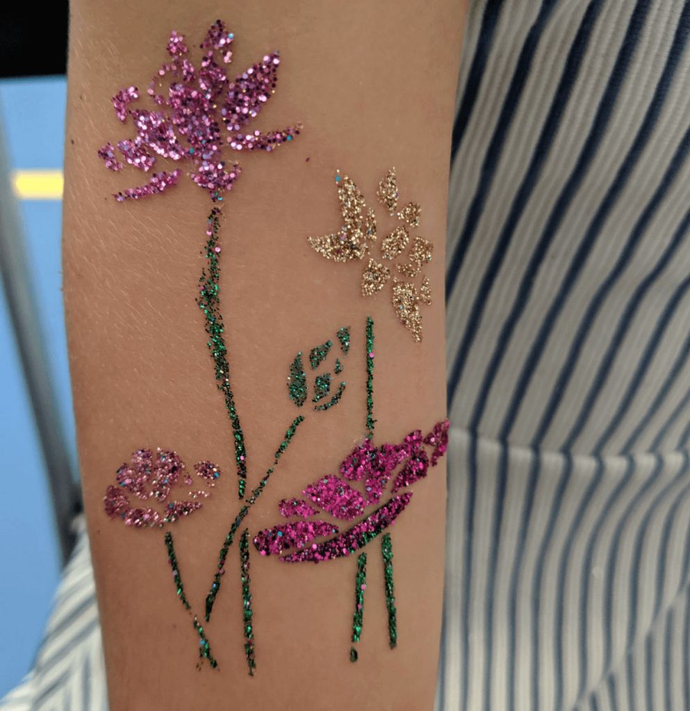 a person's arm with glitter on it